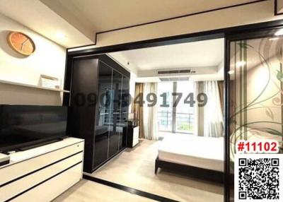 Modern bedroom with large window and sliding wardrobe