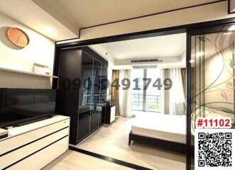 Modern bedroom with large window and sliding wardrobe