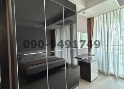 Spacious bedroom with large wardrobe and abundant natural light
