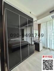 Spacious bedroom with large wardrobe and abundant natural light