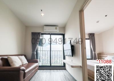 Modern living room with balcony access and natural light