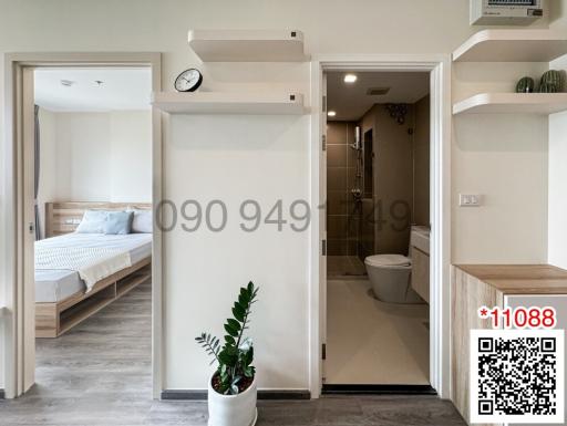 Modern apartment interior with view into bedroom and bathroom
