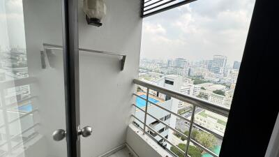 High-rise balcony with city view and safety railing