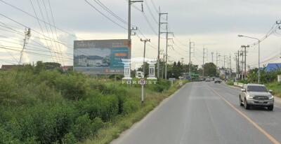 42220 - Empty land for sale, area 14 rai, next to the road on 2 sides, near Map Pong intersection, Phan Thong, Chonburi.