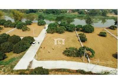 90726 - Land for sale, area 6-1-97.20 rai, next to the Ping River, Lamphun.
