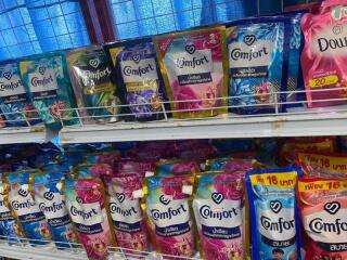 Variety of laundry detergents on store shelves
