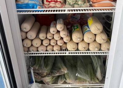 Fully stocked refrigerator interior with various food items