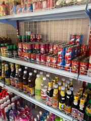 Shelves stocked with various grocery items in a store