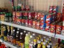 Shelves stocked with various grocery items in a store