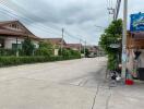 Suburban street view with residential houses and utility poles