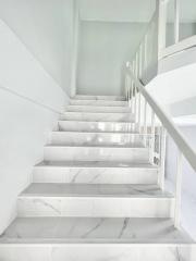 Minimalist white marble staircase with sleek design