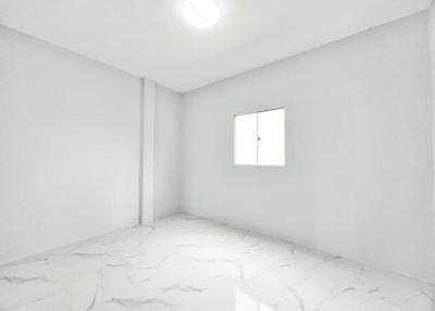 Spacious and Bright Empty Bedroom with Large Window