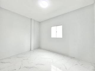 Spacious and Bright Empty Bedroom with Large Window