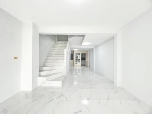 Bright spacious interior with marble floors and staircase