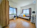 Cozy bedroom with natural lighting and wooden flooring