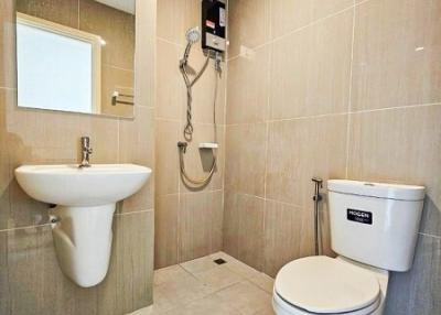 Modern bathroom with sleek fixtures and tiled walls