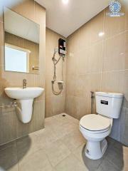 Modern bathroom with sleek fixtures and tiled walls