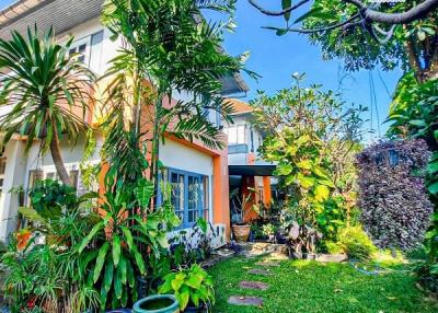 Exterior view of a house with lush garden