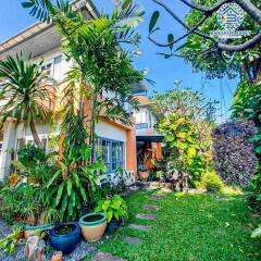 Exterior view of a house with lush garden