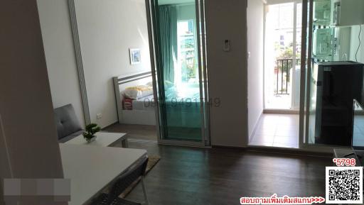 Spacious living room with natural light and balcony access