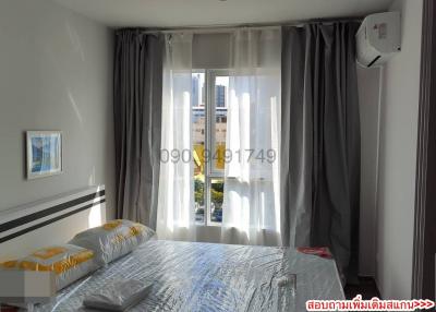 Cozy modern bedroom with natural light and balcony access