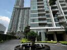 Exterior view of a modern apartment complex with a fountain