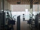 Modern gym with floor-to-ceiling windows and city view