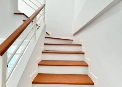Bright and modern staircase with wooden steps
