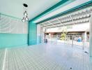 Covered patio area with tile flooring and metal security door