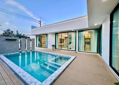 Modern home exterior with swimming pool and deck