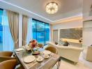 Elegant dining and living room with modern furnishings and ample lighting
