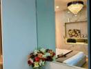 Elegant Bedroom with Chandelier and Floral Arrangement