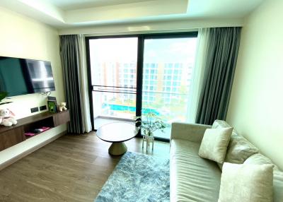 Modern living room with natural light and balcony access