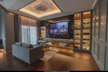 Modern living room interior with mounted TV and cozy seating