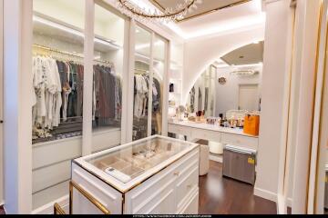 Spacious walk-in closet with custom shelving and center island