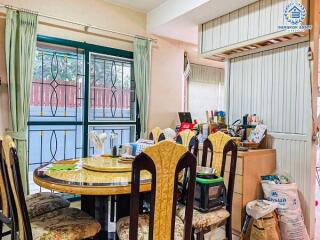 Dining room with table and chairs near a window with natural light