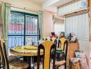 Dining room with table and chairs near a window with natural light