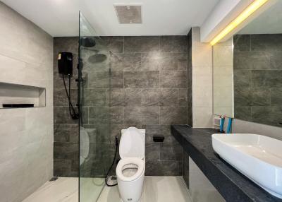 Modern bathroom with walk-in shower and stylish fixtures