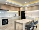 Modern kitchen with wooden accents and integrated appliances