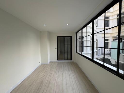 Spacious and well-lit living room with large windows