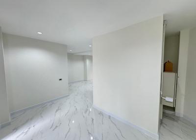 Bright and spacious empty interior of a modern building with marble flooring