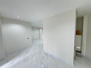 Bright and spacious empty interior of a modern building with marble flooring