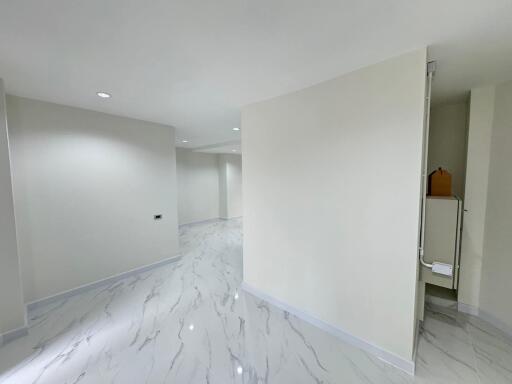 Bright and spacious empty interior of a modern building with marble flooring