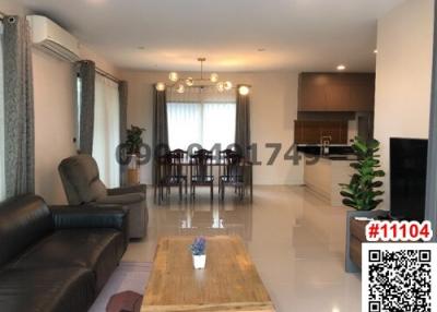 Spacious living room with open dining and kitchen area