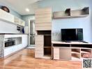 Contemporary living room with television and built-in shelving