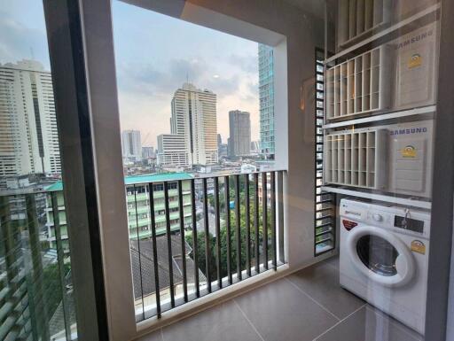 Balcony with a City View Including Appliances