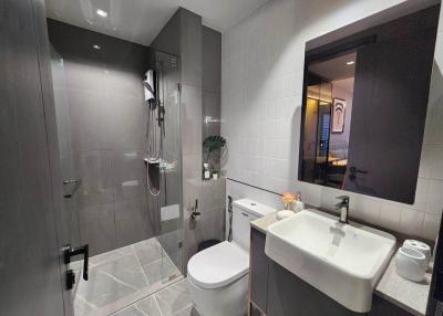 Modern bathroom with glass shower enclosure and vessel sink