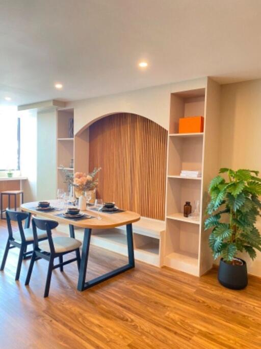 Modern dining room with natural light and wooden flooring