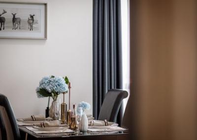 Elegant dining room with set table and modern decor