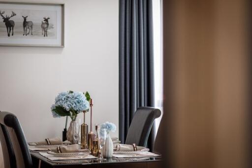 Elegant dining room with set table and modern decor